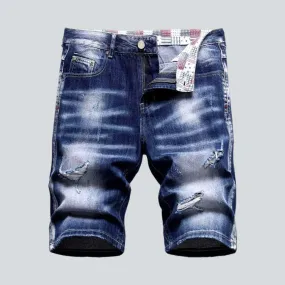 Whiskered ripped men's denim shorts